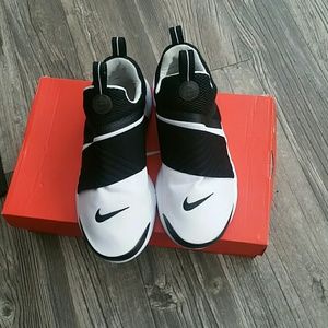 White and black Nike shoes